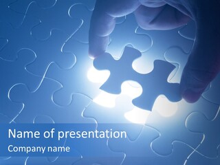 A Person Holding A Piece Of A Puzzle PowerPoint Template
