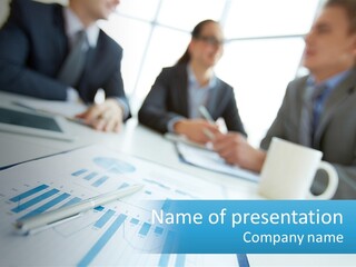 A Group Of Business People Sitting Around A Table PowerPoint Template