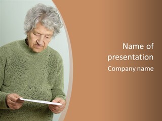 An Elderly Woman Holding A Piece Of Paper In Her Hands PowerPoint Template