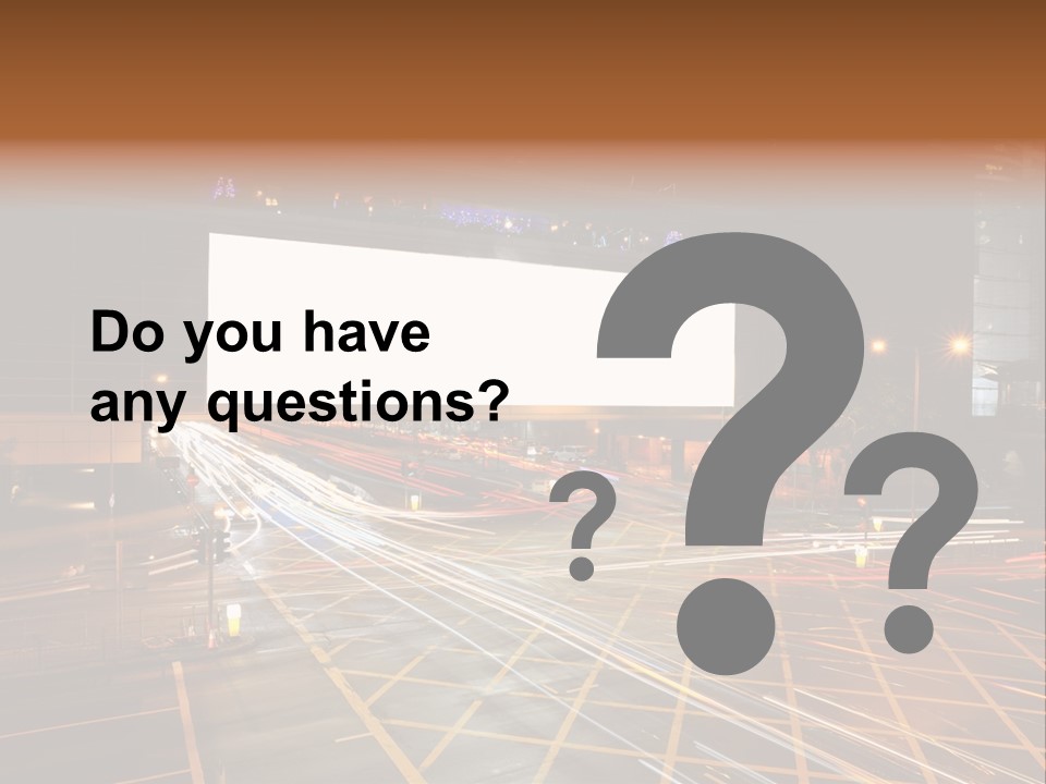 A City Street At Night With A Large Billboard In The Middle Of It PowerPoint Template