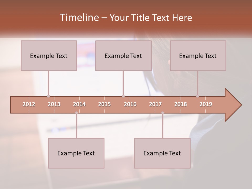 A Young Girl Is Looking At A Computer Screen PowerPoint Template