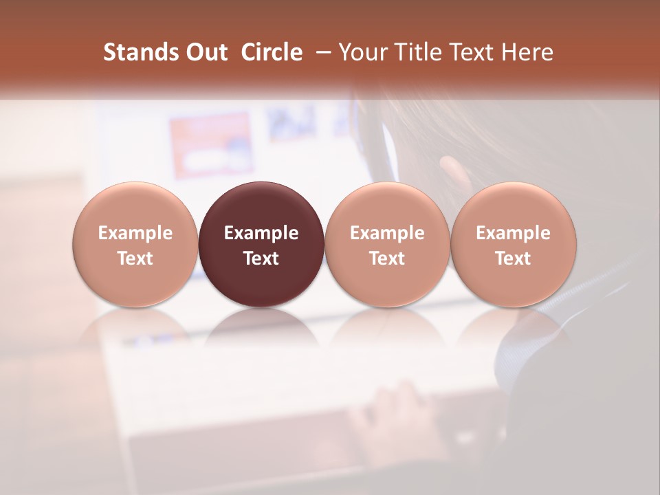 A Young Girl Is Looking At A Computer Screen PowerPoint Template