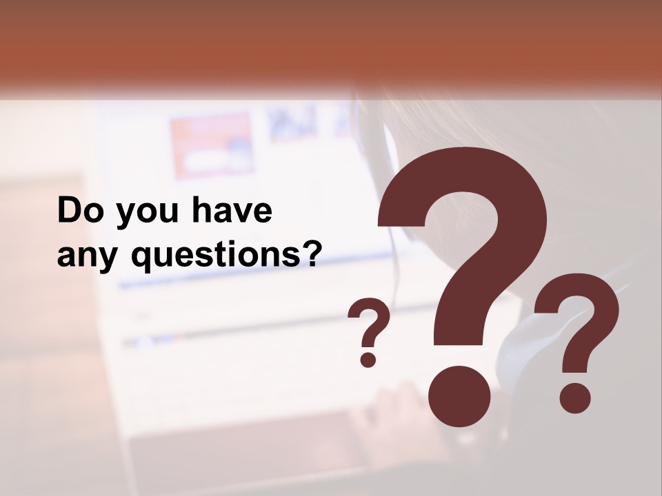 A Young Girl Is Looking At A Computer Screen PowerPoint Template