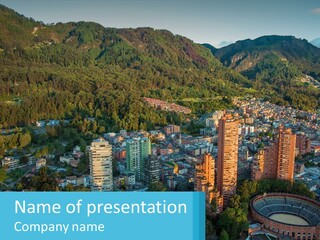 An Aerial View Of A City With Mountains In The Background PowerPoint Template