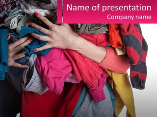 A Woman Is Holding A Pile Of Clothes PowerPoint Template