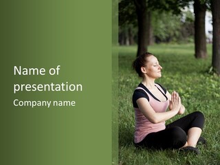 A Woman Is Sitting In The Grass With Her Hands Together PowerPoint Template