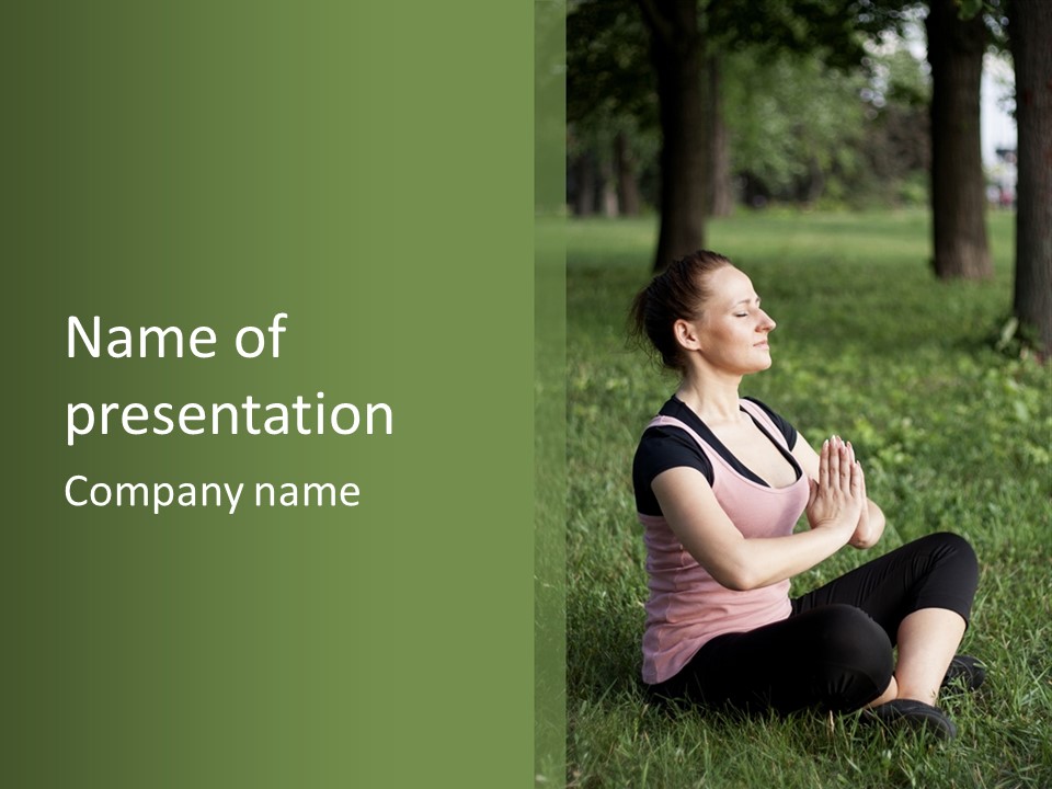 A Woman Is Sitting In The Grass With Her Hands Together PowerPoint Template