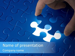 A Person Touching A Piece Of A Puzzle PowerPoint Template
