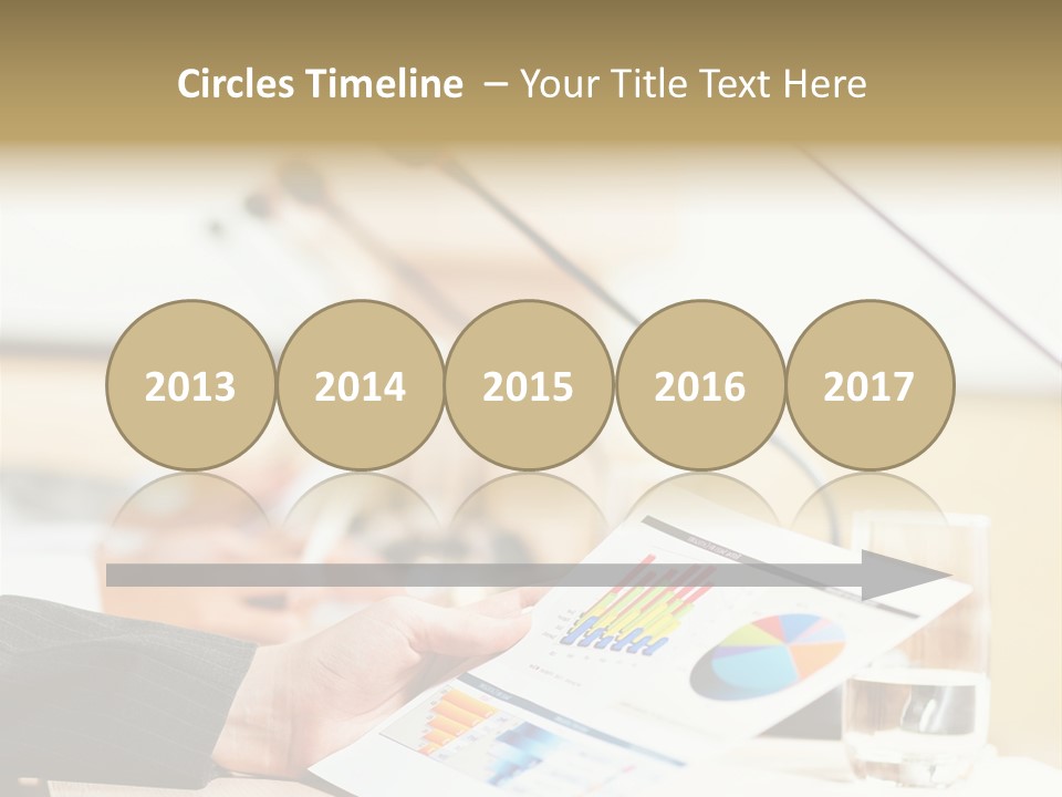 A Person Sitting At A Desk With Microphones In Front Of Them PowerPoint Template