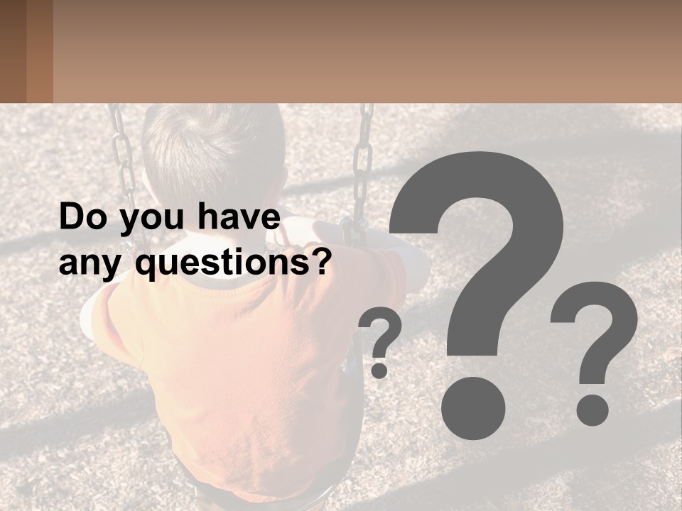 A Little Boy Sitting On A Swing In A Playground PowerPoint Template