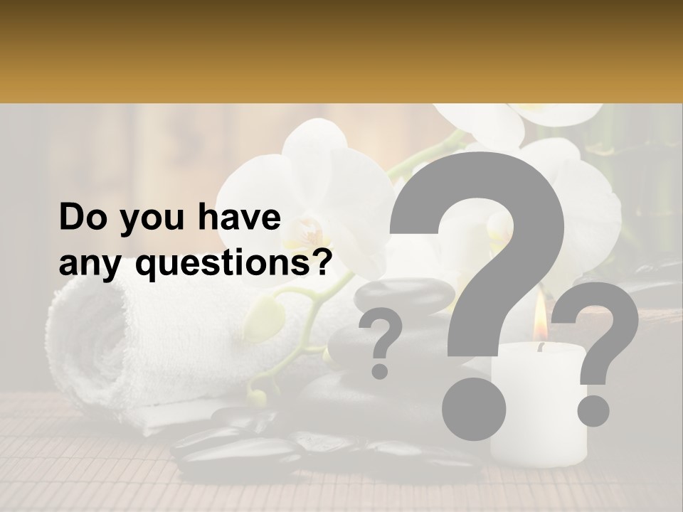 A White Candle And Some Black Rocks On A Table PowerPoint Template