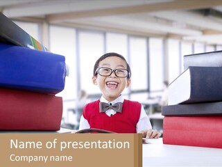 A Young Boy Sitting At A Table With A Pile Of Books PowerPoint Template