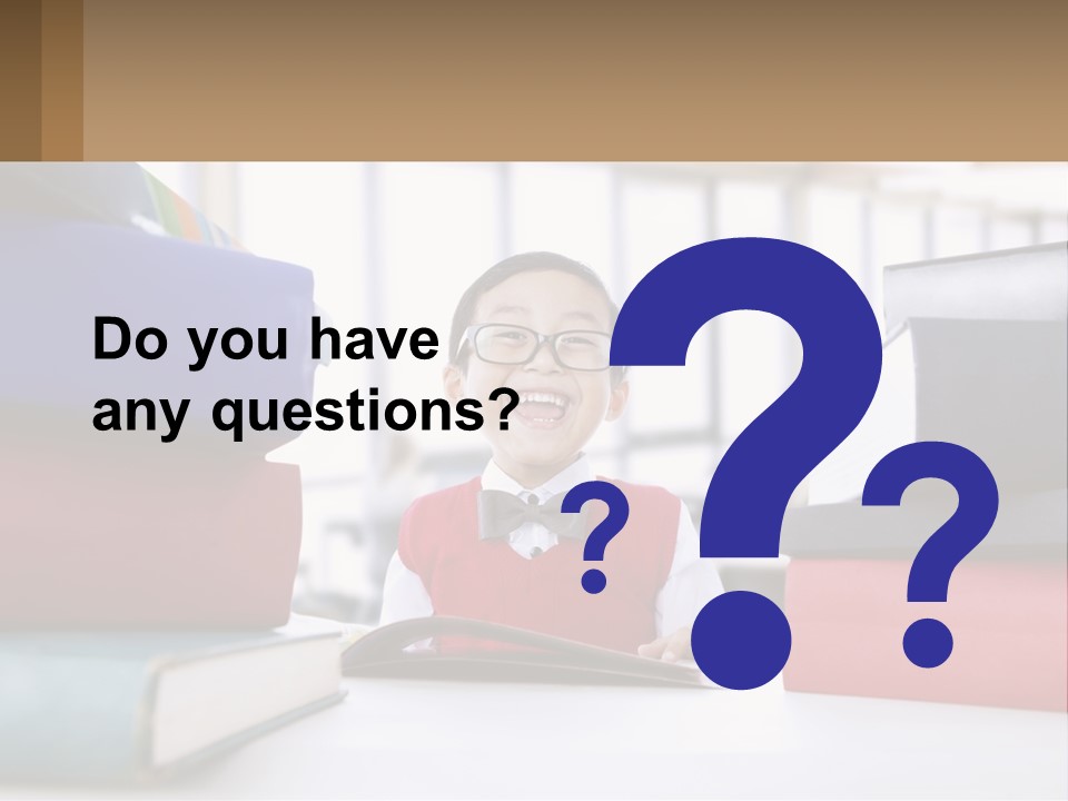 A Young Boy Sitting At A Table With A Pile Of Books PowerPoint Template