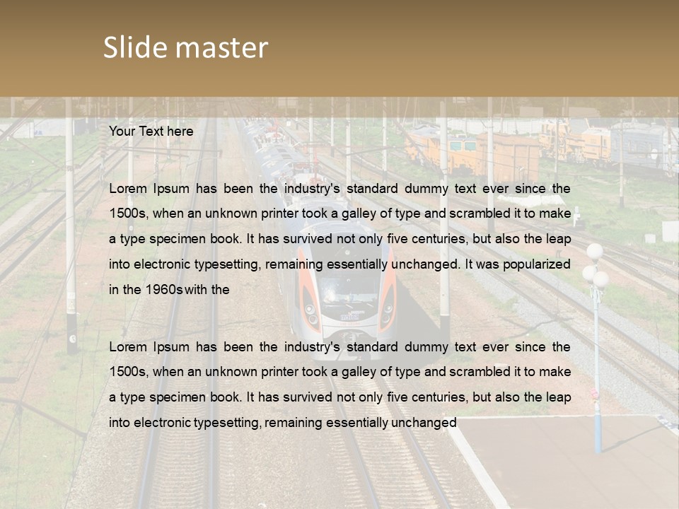 A Train Traveling Down Train Tracks Next To A Field PowerPoint Template