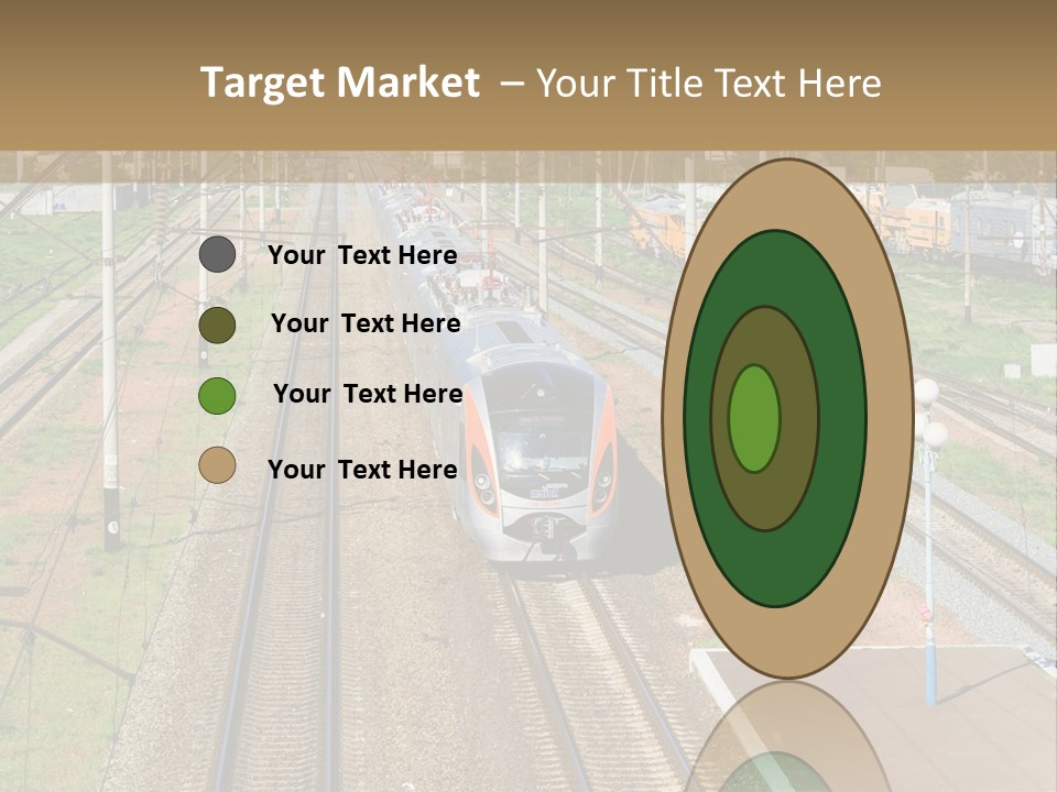 A Train Traveling Down Train Tracks Next To A Field PowerPoint Template