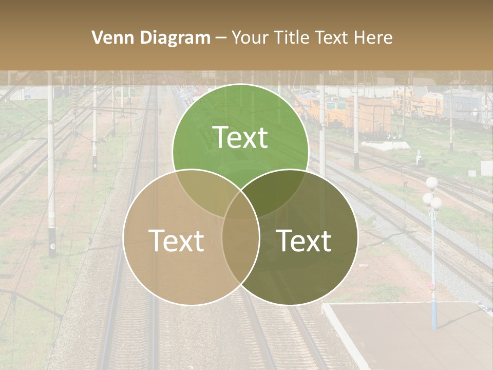 A Train Traveling Down Train Tracks Next To A Field PowerPoint Template