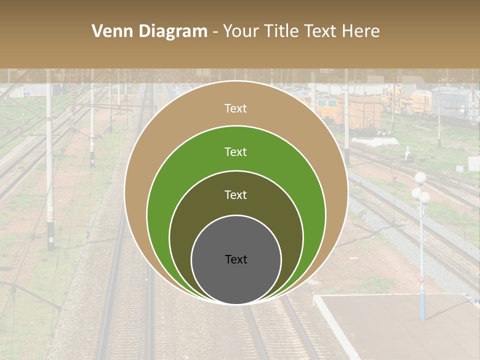 A Train Traveling Down Train Tracks Next To A Field PowerPoint Template