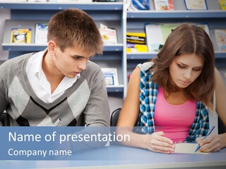 A Man And A Woman Sitting At A Table Writing PowerPoint Template
