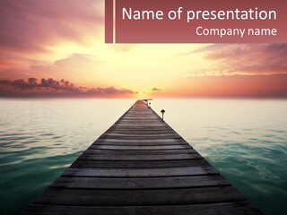 A Wooden Dock In The Middle Of A Body Of Water PowerPoint Template
