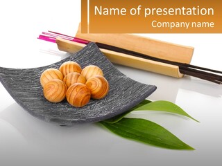 A Plate Of Food With Chopsticks And Chopsticks Next To It PowerPoint Template