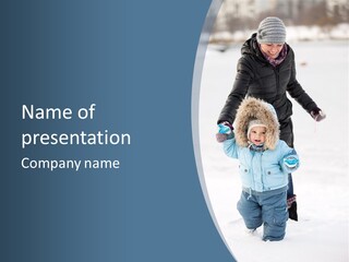 A Woman And A Child Playing In The Snow PowerPoint Template