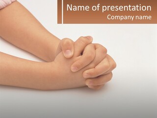 A Child's Hands Holding Another Child's Hand PowerPoint Template