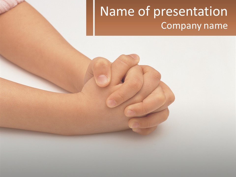 A Child's Hands Holding Another Child's Hand PowerPoint Template