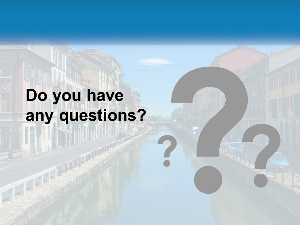 A River Running Through A City Next To Tall Buildings PowerPoint Template