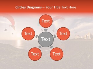 A Group Of Paraglides Flying Over A Body Of Water PowerPoint Template