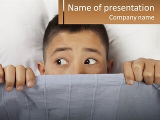 A Boy Peeking Over A Pillow With His Eyes Wide Open PowerPoint Template