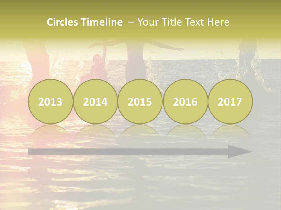 A Group Of People Splashing In The Water At Sunset PowerPoint Template