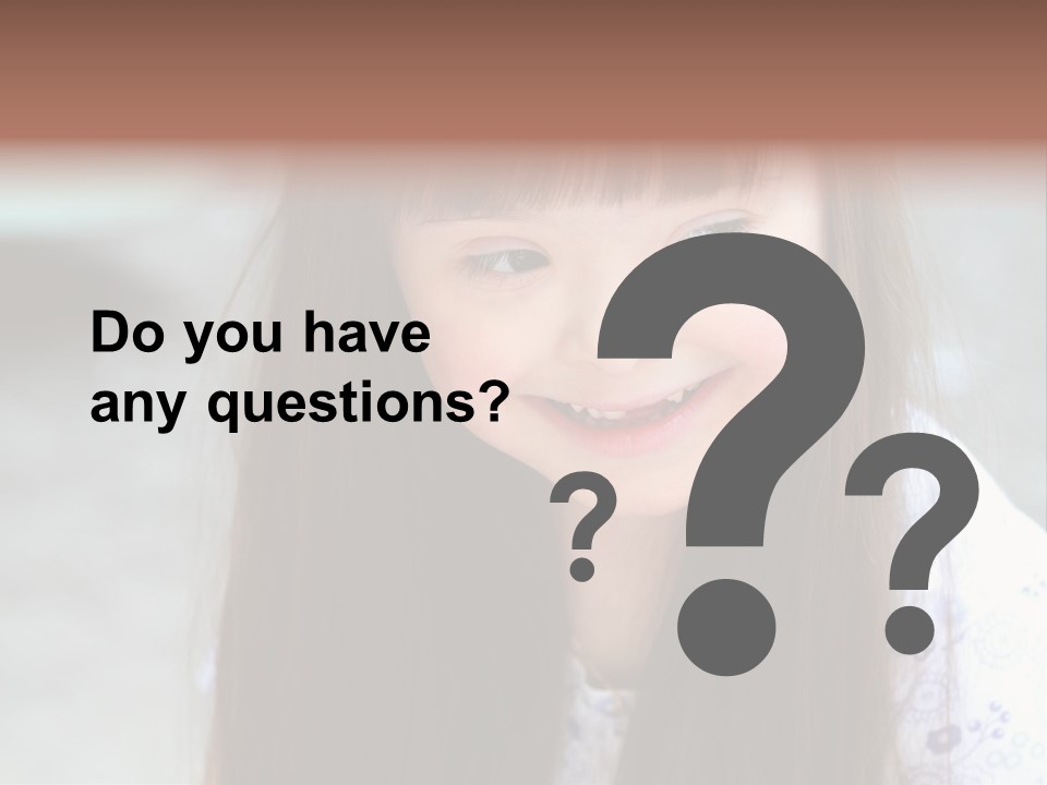 A Young Girl With Long Brown Hair Smiles At The Camera PowerPoint Template