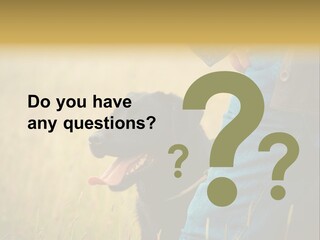 A Person Holding A Black Dog In A Field PowerPoint Template
