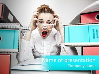 A Woman In Glasses Is Sitting At A Desk With Many Files PowerPoint Template