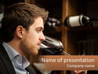 A Man Drinking A Glass Of Wine From A Wine Glass PowerPoint Template