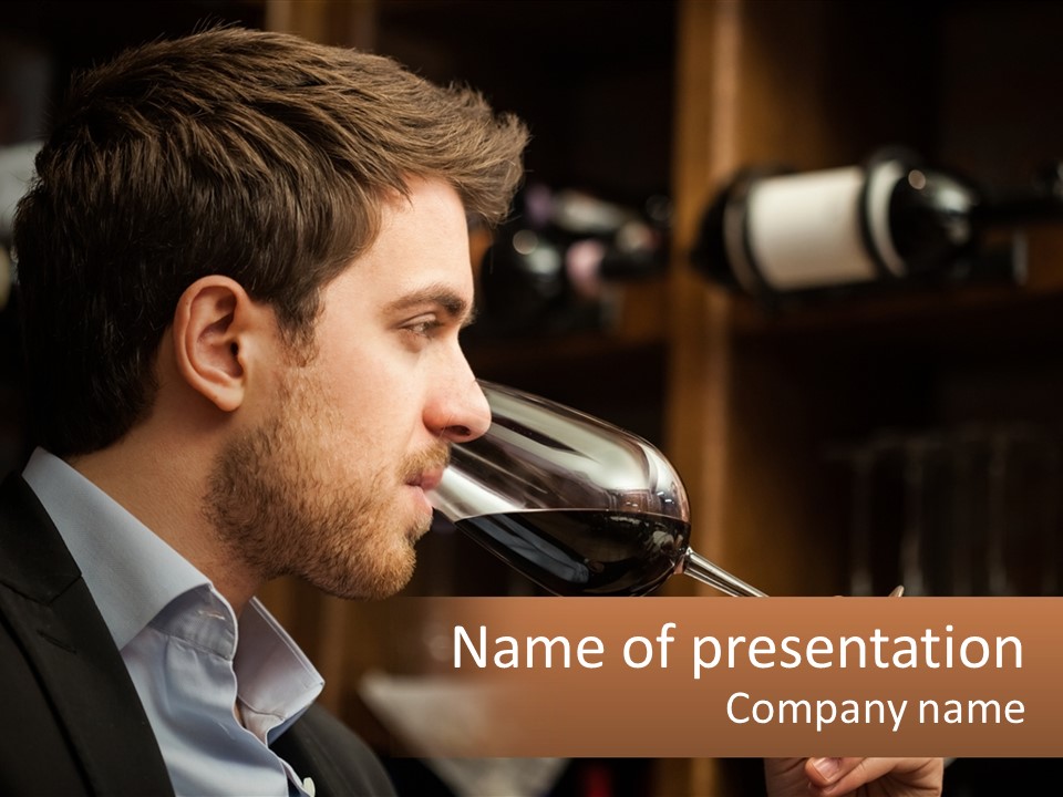 A Man Drinking A Glass Of Wine From A Wine Glass PowerPoint Template