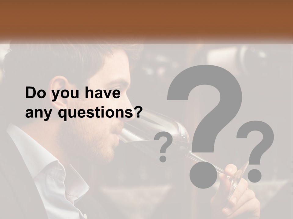 A Man Drinking A Glass Of Wine From A Wine Glass PowerPoint Template