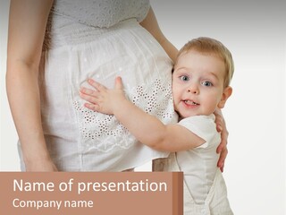 A Woman Holding A Baby In Her Arms PowerPoint Template