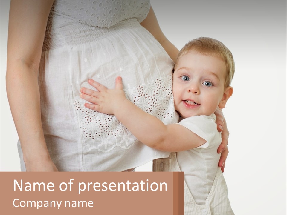 A Woman Holding A Baby In Her Arms PowerPoint Template