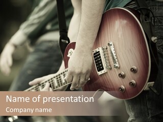 A Person Holding A Guitar In Their Hand PowerPoint Template