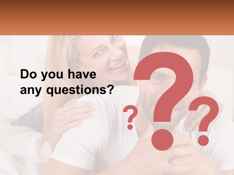 A Man And Woman Laying On A Bed Smiling PowerPoint Template