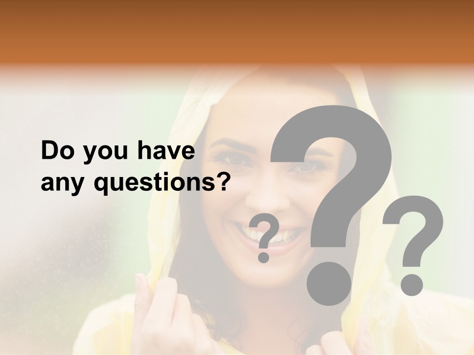 A Woman In A Yellow Raincoat Is Smiling PowerPoint Template