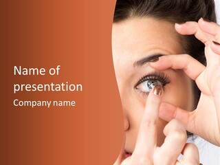 A Woman Putting A Contact Lens On Her Eye PowerPoint Template