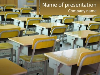 A Classroom Filled With Yellow Desks And Chairs PowerPoint Template