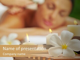 A Woman Getting A Back Massage With Candles PowerPoint Template