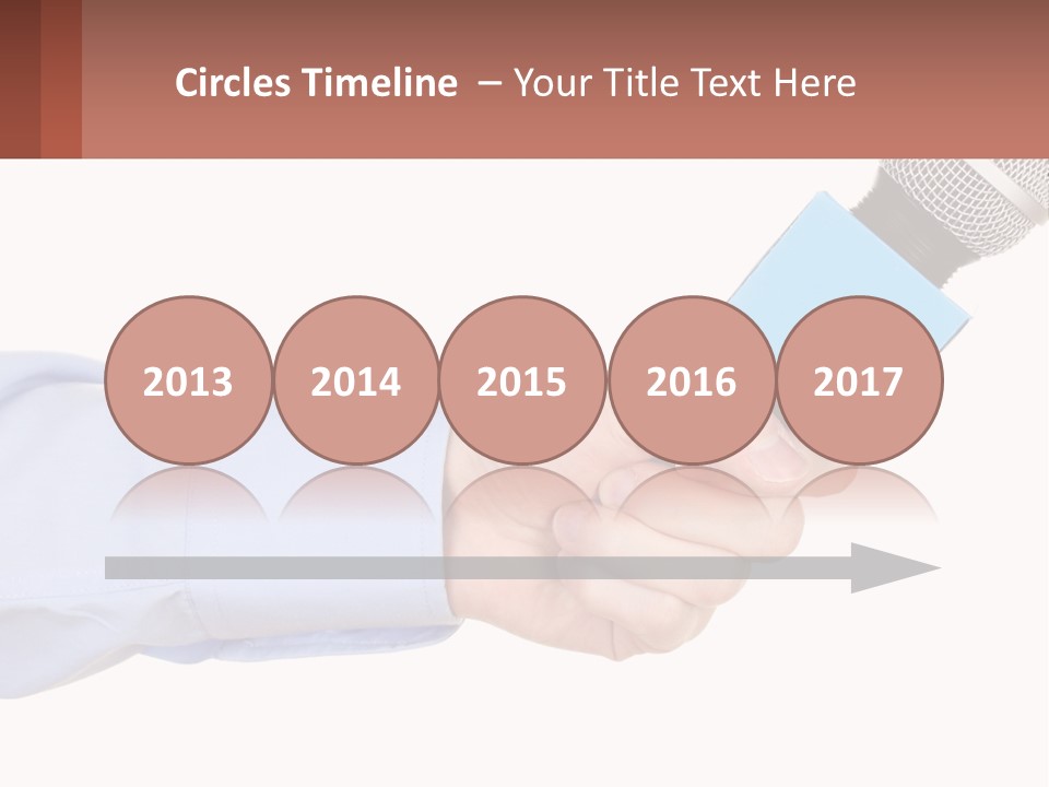 A Person Holding A Microphone In Their Hand PowerPoint Template