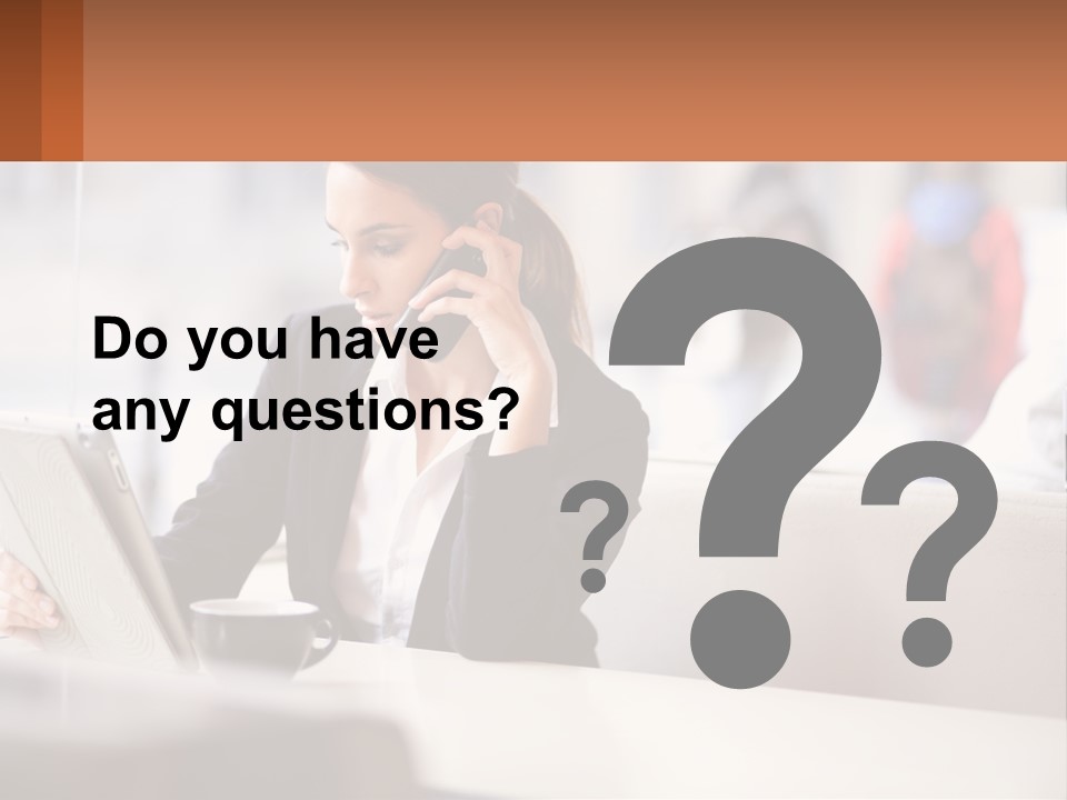 A Woman Talking On A Cell Phone While Using A Laptop PowerPoint Template