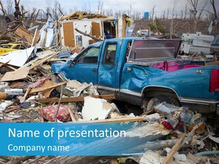 A Blue Truck Parked In A Pile Of Rubble PowerPoint Template