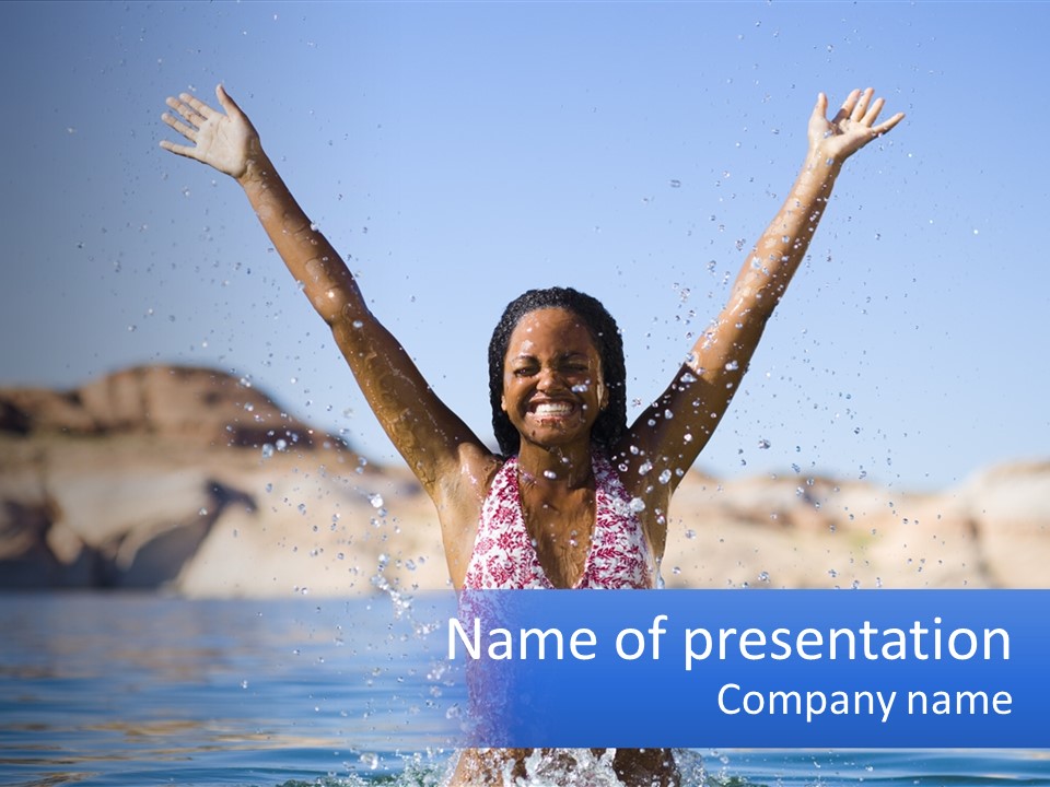 A Woman In The Water With Her Arms Up In The Air PowerPoint Template