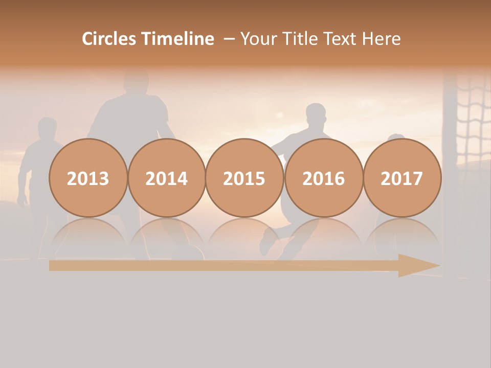 A Group Of People Playing Soccer At Sunset PowerPoint Template